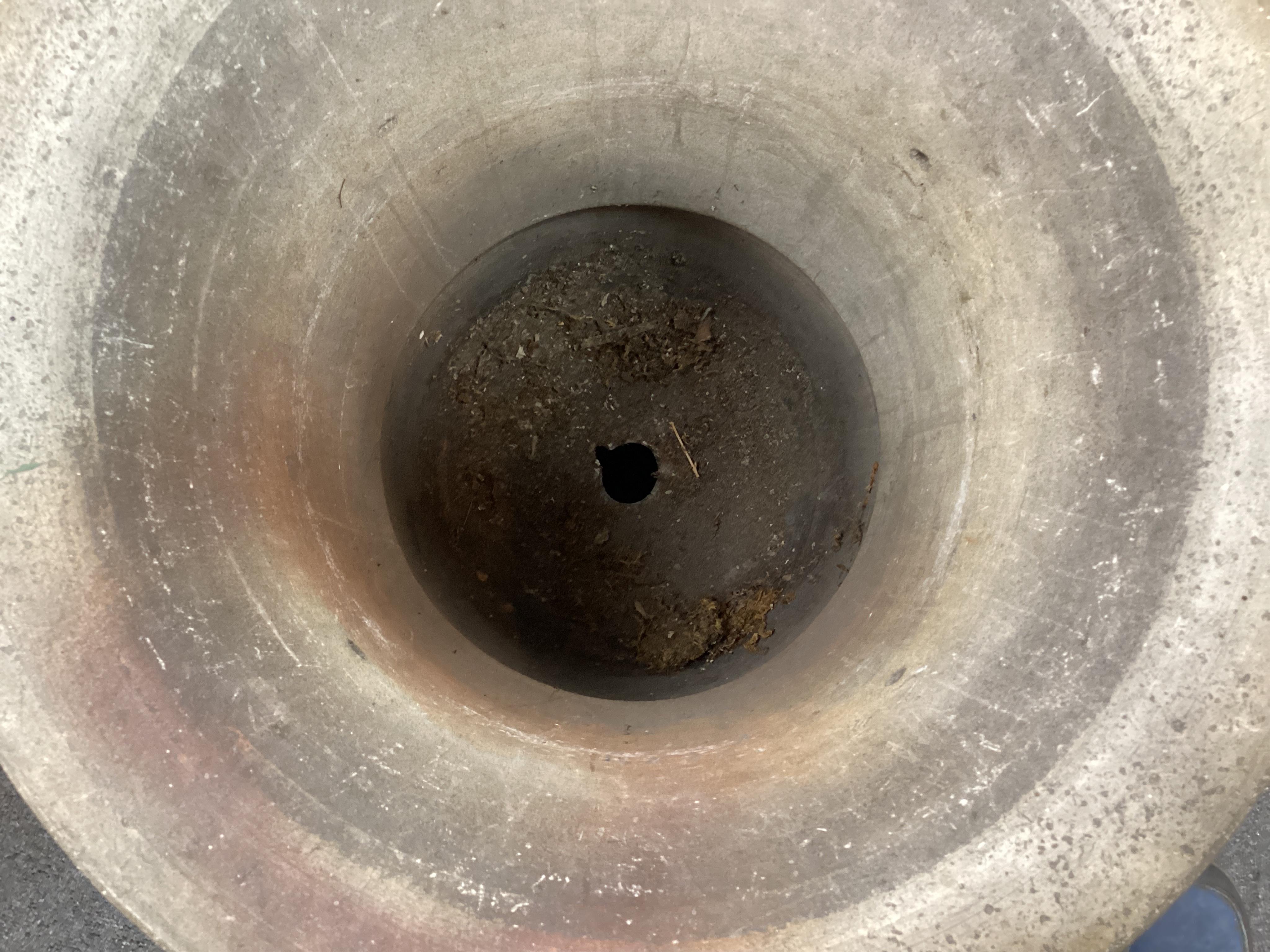 A 19th century circular earthenware urn